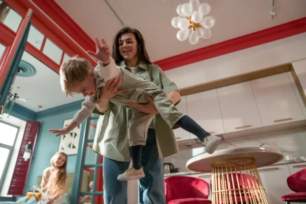 4 Simple Yet Enjoyable Activities to Do in Your Family Room Family enjoying fun activities in the family room