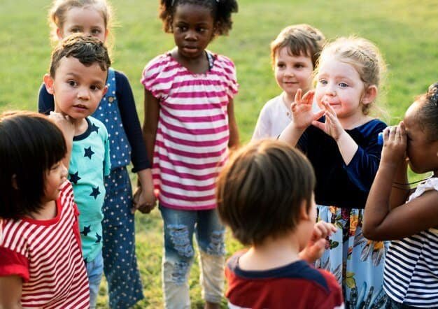 a group of children standing in a circle
